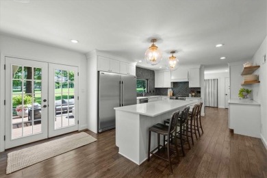 Welcome to this stunning 1.5-story Tudor-style home nestled on on Leawood South Country Club in Kansas - for sale on GolfHomes.com, golf home, golf lot