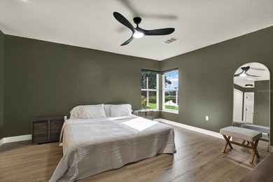 Wake up to panoramic water and fairway views from this fully on Links At Greenfield Plantation in Florida - for sale on GolfHomes.com, golf home, golf lot