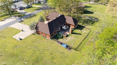 Welcome to this gorgeous home located in the sought after gated on The Coves Golf Course in Oklahoma - for sale on GolfHomes.com, golf home, golf lot