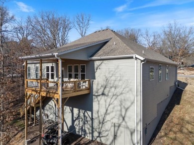 This stunning single-story home offers 4 spacious bedrooms, 3 on Bella Vista Country Club - Berksdale in Arkansas - for sale on GolfHomes.com, golf home, golf lot