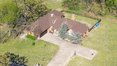 Welcome to this gorgeous home located in the sought after gated on The Coves Golf Course in Oklahoma - for sale on GolfHomes.com, golf home, golf lot