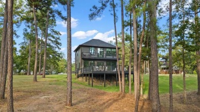 Experience unparalleled lakeside living at 147 Brushwood Ct on Rayburn Country Club in Texas - for sale on GolfHomes.com, golf home, golf lot