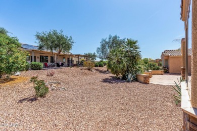 Handsome stone trimmed exterior! Desert Rose model offers an on Cimarron Golf Club in Arizona - for sale on GolfHomes.com, golf home, golf lot