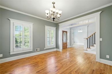 Overlooking manicured fairways and a sparkling lake, this home on The Golf Club At Bradshaw Farm in Georgia - for sale on GolfHomes.com, golf home, golf lot