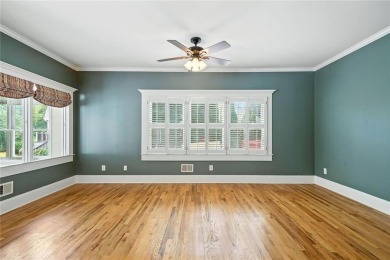 Overlooking manicured fairways and a sparkling lake, this home on The Golf Club At Bradshaw Farm in Georgia - for sale on GolfHomes.com, golf home, golf lot