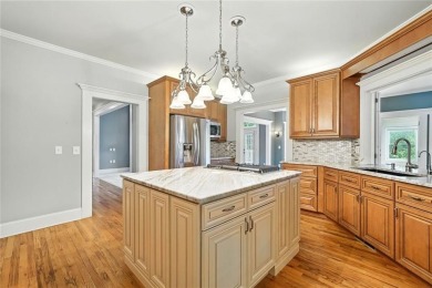 Overlooking manicured fairways and a sparkling lake, this home on The Golf Club At Bradshaw Farm in Georgia - for sale on GolfHomes.com, golf home, golf lot