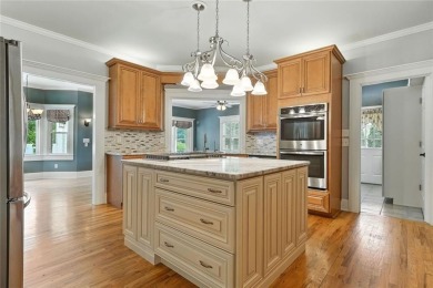 Overlooking manicured fairways and a sparkling lake, this home on The Golf Club At Bradshaw Farm in Georgia - for sale on GolfHomes.com, golf home, golf lot