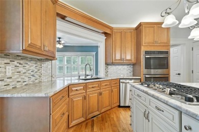Overlooking manicured fairways and a sparkling lake, this home on The Golf Club At Bradshaw Farm in Georgia - for sale on GolfHomes.com, golf home, golf lot