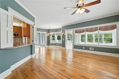 Overlooking manicured fairways and a sparkling lake, this home on The Golf Club At Bradshaw Farm in Georgia - for sale on GolfHomes.com, golf home, golf lot