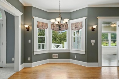 Overlooking manicured fairways and a sparkling lake, this home on The Golf Club At Bradshaw Farm in Georgia - for sale on GolfHomes.com, golf home, golf lot