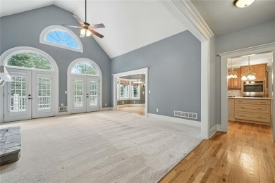 Overlooking manicured fairways and a sparkling lake, this home on The Golf Club At Bradshaw Farm in Georgia - for sale on GolfHomes.com, golf home, golf lot