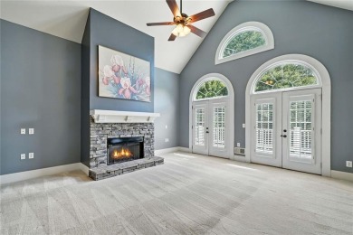 Overlooking manicured fairways and a sparkling lake, this home on The Golf Club At Bradshaw Farm in Georgia - for sale on GolfHomes.com, golf home, golf lot