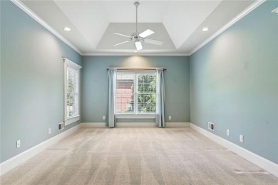 Overlooking manicured fairways and a sparkling lake, this home on The Golf Club At Bradshaw Farm in Georgia - for sale on GolfHomes.com, golf home, golf lot