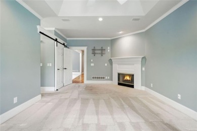 Overlooking manicured fairways and a sparkling lake, this home on The Golf Club At Bradshaw Farm in Georgia - for sale on GolfHomes.com, golf home, golf lot