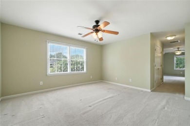 Overlooking manicured fairways and a sparkling lake, this home on The Golf Club At Bradshaw Farm in Georgia - for sale on GolfHomes.com, golf home, golf lot