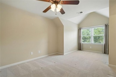 Overlooking manicured fairways and a sparkling lake, this home on The Golf Club At Bradshaw Farm in Georgia - for sale on GolfHomes.com, golf home, golf lot