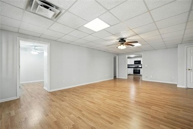 Overlooking manicured fairways and a sparkling lake, this home on The Golf Club At Bradshaw Farm in Georgia - for sale on GolfHomes.com, golf home, golf lot