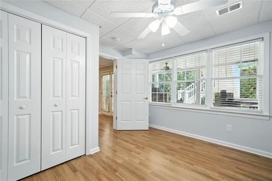 Overlooking manicured fairways and a sparkling lake, this home on The Golf Club At Bradshaw Farm in Georgia - for sale on GolfHomes.com, golf home, golf lot