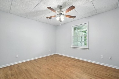 Overlooking manicured fairways and a sparkling lake, this home on The Golf Club At Bradshaw Farm in Georgia - for sale on GolfHomes.com, golf home, golf lot