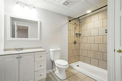 Overlooking manicured fairways and a sparkling lake, this home on The Golf Club At Bradshaw Farm in Georgia - for sale on GolfHomes.com, golf home, golf lot