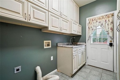 Overlooking manicured fairways and a sparkling lake, this home on The Golf Club At Bradshaw Farm in Georgia - for sale on GolfHomes.com, golf home, golf lot