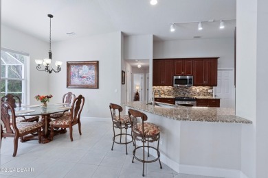 Gorgeous pool home nestled on a quiet street in the highly on Plantation Bay Golf and Country Club in Florida - for sale on GolfHomes.com, golf home, golf lot