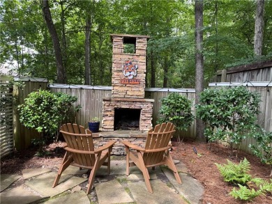 Nestled on a serene, wooded lot with immaculate landscaping and on Moores Mill Golf Club in Alabama - for sale on GolfHomes.com, golf home, golf lot