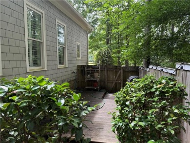 Nestled on a serene, wooded lot with immaculate landscaping and on Moores Mill Golf Club in Alabama - for sale on GolfHomes.com, golf home, golf lot