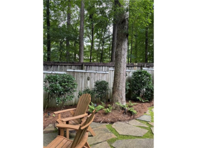 Nestled on a serene, wooded lot with immaculate landscaping and on Moores Mill Golf Club in Alabama - for sale on GolfHomes.com, golf home, golf lot