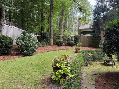 Nestled on a serene, wooded lot with immaculate landscaping and on Moores Mill Golf Club in Alabama - for sale on GolfHomes.com, golf home, golf lot