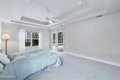 Gorgeous pool home nestled on a quiet street in the highly on Plantation Bay Golf and Country Club in Florida - for sale on GolfHomes.com, golf home, golf lot