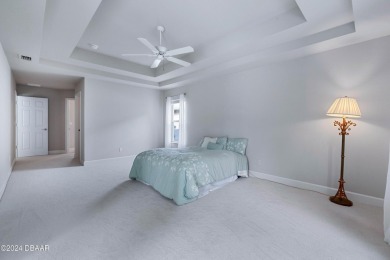 Gorgeous pool home nestled on a quiet street in the highly on Plantation Bay Golf and Country Club in Florida - for sale on GolfHomes.com, golf home, golf lot