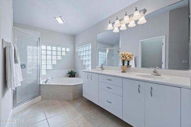 Gorgeous pool home nestled on a quiet street in the highly on Plantation Bay Golf and Country Club in Florida - for sale on GolfHomes.com, golf home, golf lot