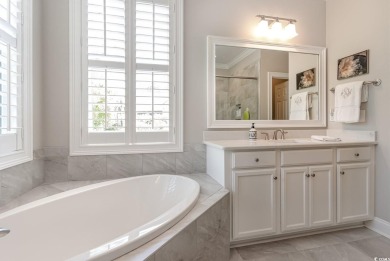 Step into the lap of luxury in this stunning 4-bedroom on Pawleys Plantation Golf and Country Club in South Carolina - for sale on GolfHomes.com, golf home, golf lot