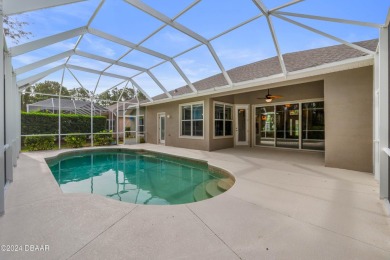 Gorgeous pool home nestled on a quiet street in the highly on Plantation Bay Golf and Country Club in Florida - for sale on GolfHomes.com, golf home, golf lot