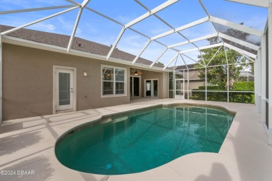 Gorgeous pool home nestled on a quiet street in the highly on Plantation Bay Golf and Country Club in Florida - for sale on GolfHomes.com, golf home, golf lot