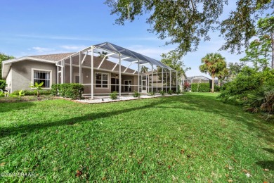 Gorgeous pool home nestled on a quiet street in the highly on Plantation Bay Golf and Country Club in Florida - for sale on GolfHomes.com, golf home, golf lot