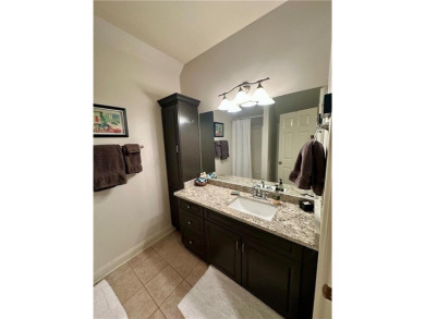 Nestled on a serene, wooded lot with immaculate landscaping and on Moores Mill Golf Club in Alabama - for sale on GolfHomes.com, golf home, golf lot