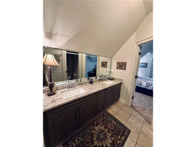 Nestled on a serene, wooded lot with immaculate landscaping and on Moores Mill Golf Club in Alabama - for sale on GolfHomes.com, golf home, golf lot