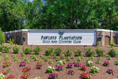 Step into the lap of luxury in this stunning 4-bedroom on Pawleys Plantation Golf and Country Club in South Carolina - for sale on GolfHomes.com, golf home, golf lot