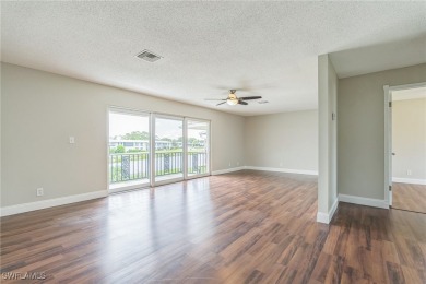Wonderful second floor 2/2 unit looking out on the water of the on The Glades Golf and Country Club in Florida - for sale on GolfHomes.com, golf home, golf lot