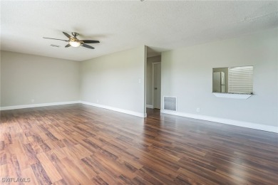 Wonderful second floor 2/2 unit looking out on the water of the on The Glades Golf and Country Club in Florida - for sale on GolfHomes.com, golf home, golf lot