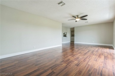 Wonderful second floor 2/2 unit looking out on the water of the on The Glades Golf and Country Club in Florida - for sale on GolfHomes.com, golf home, golf lot