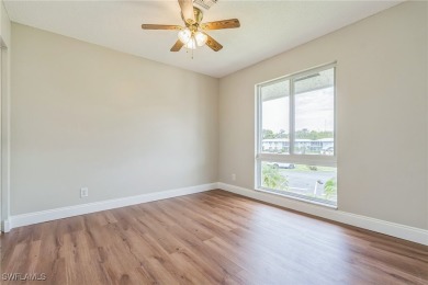 Wonderful second floor 2/2 unit looking out on the water of the on The Glades Golf and Country Club in Florida - for sale on GolfHomes.com, golf home, golf lot