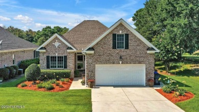 Situated on a picturesque half-acre lot, this beautiful home on Beau Rivage Golf and Resort in North Carolina - for sale on GolfHomes.com, golf home, golf lot