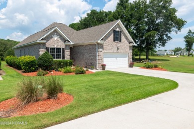 Situated on a picturesque half-acre lot, this beautiful home on Beau Rivage Golf and Resort in North Carolina - for sale on GolfHomes.com, golf home, golf lot