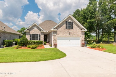 Situated on a picturesque half-acre lot, this beautiful home on Beau Rivage Golf and Resort in North Carolina - for sale on GolfHomes.com, golf home, golf lot