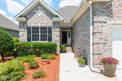 Situated on a picturesque half-acre lot, this beautiful home on Beau Rivage Golf and Resort in North Carolina - for sale on GolfHomes.com, golf home, golf lot