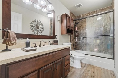 Discover One Of The Premier Locations In Woodmont, Nestled on Woodmont Country Club in Florida - for sale on GolfHomes.com, golf home, golf lot