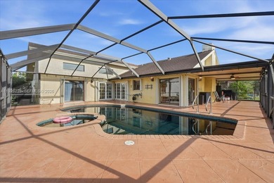 Discover One Of The Premier Locations In Woodmont, Nestled on Woodmont Country Club in Florida - for sale on GolfHomes.com, golf home, golf lot